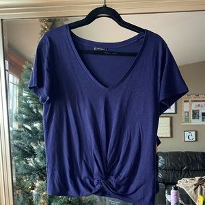 A navy T-shirt with a twist front